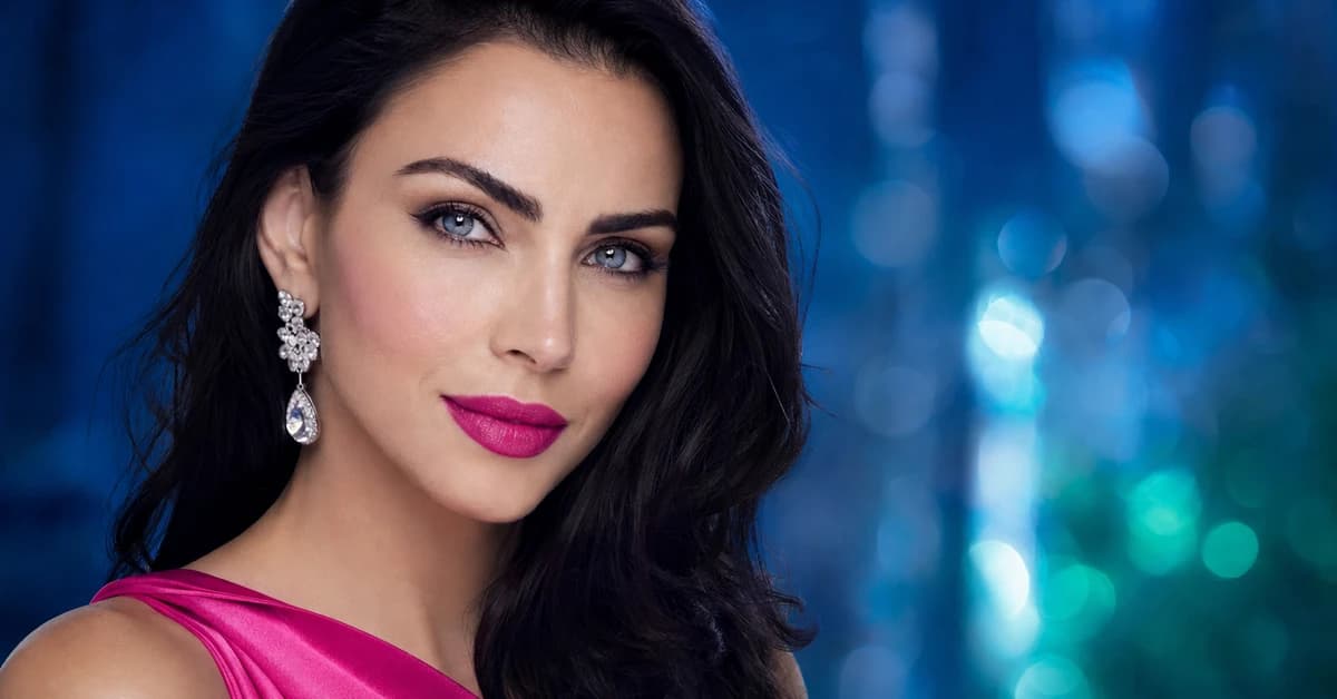Bright Winter colour analysis — a woman with cool, high-contrast Bright Winter colouring wearing an electric-blue top and silver jewellery, by ToneLala