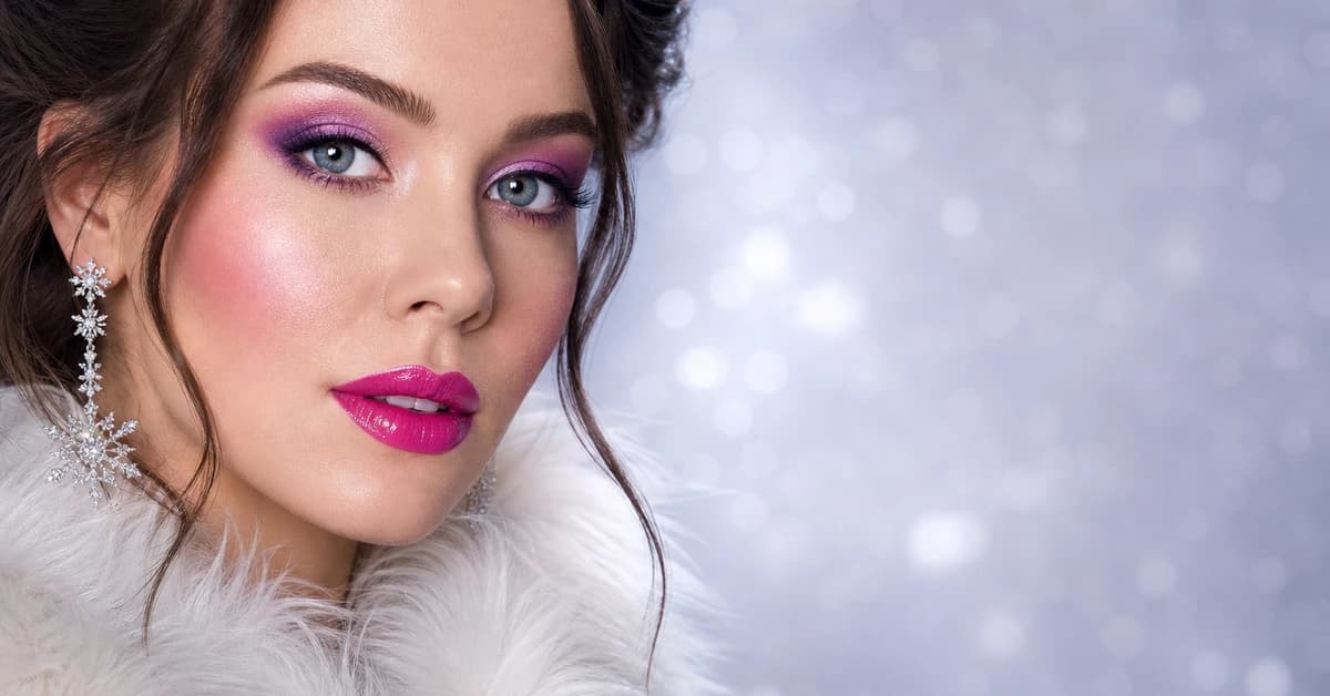 A woman wearing Bright Winter makeup — a cool true-red lip, bright pink blush and crisp black liner, by ToneLala