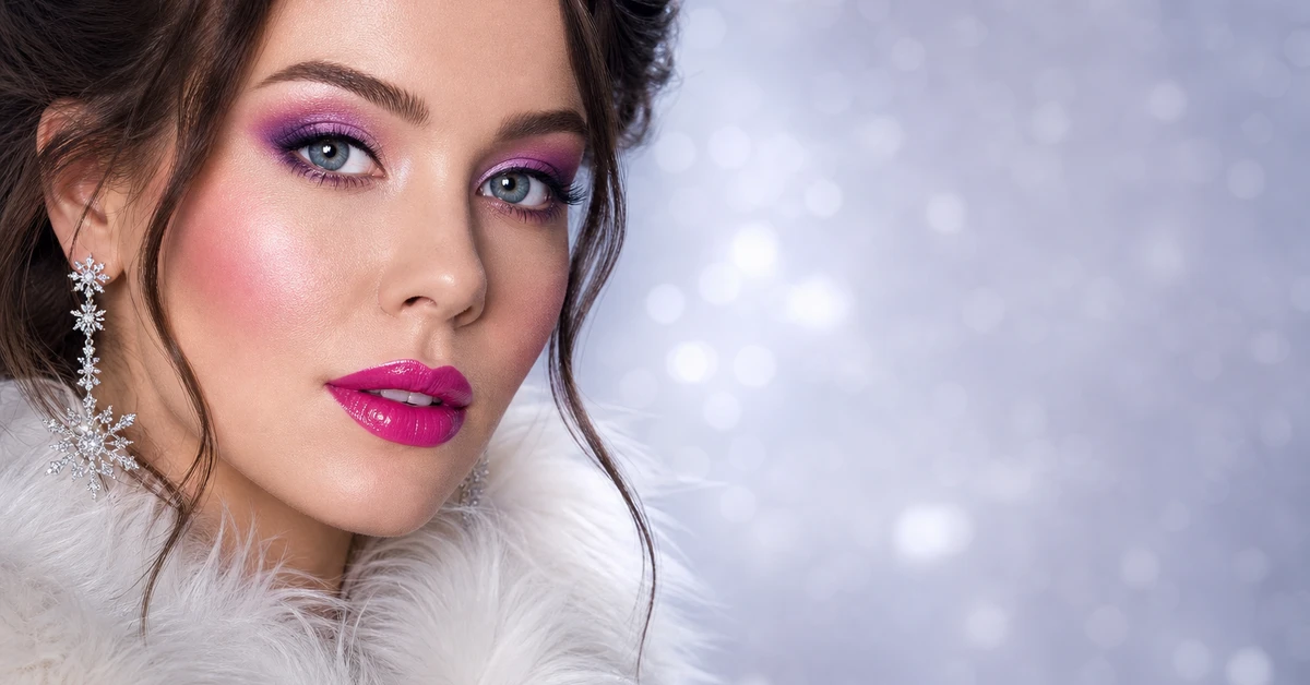 A woman wearing Bright Winter makeup — a cool true-red lip, bright pink blush and crisp black liner, by ToneLala