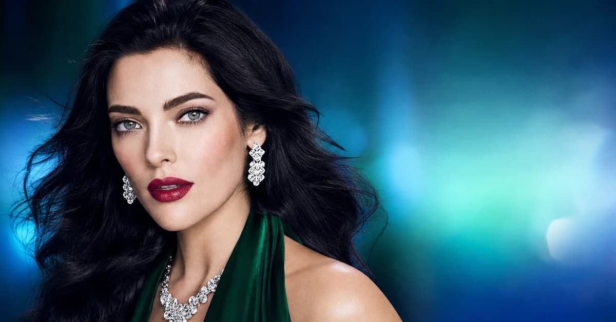 Deep Winter colour analysis — a woman with deep, cool, high-contrast Deep Winter colouring wearing a true-red top and silver jewellery, by ToneLala