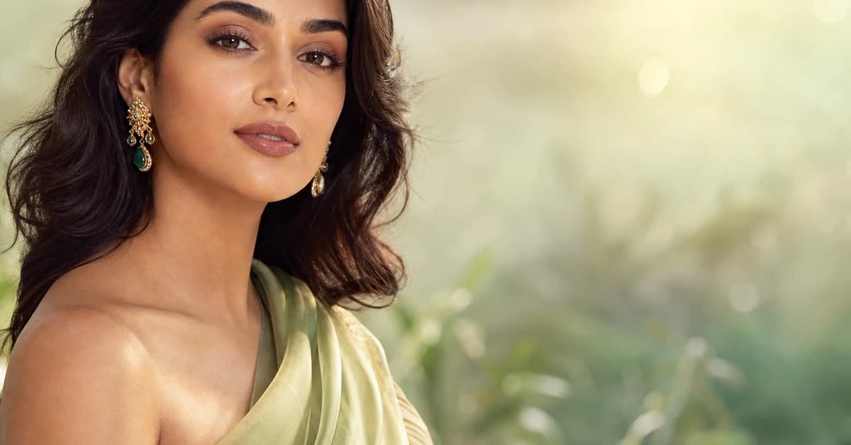 A woman with a light brown skin tone in natural daylight, holding gold and silver against her jaw to read her undertone, by ToneLala