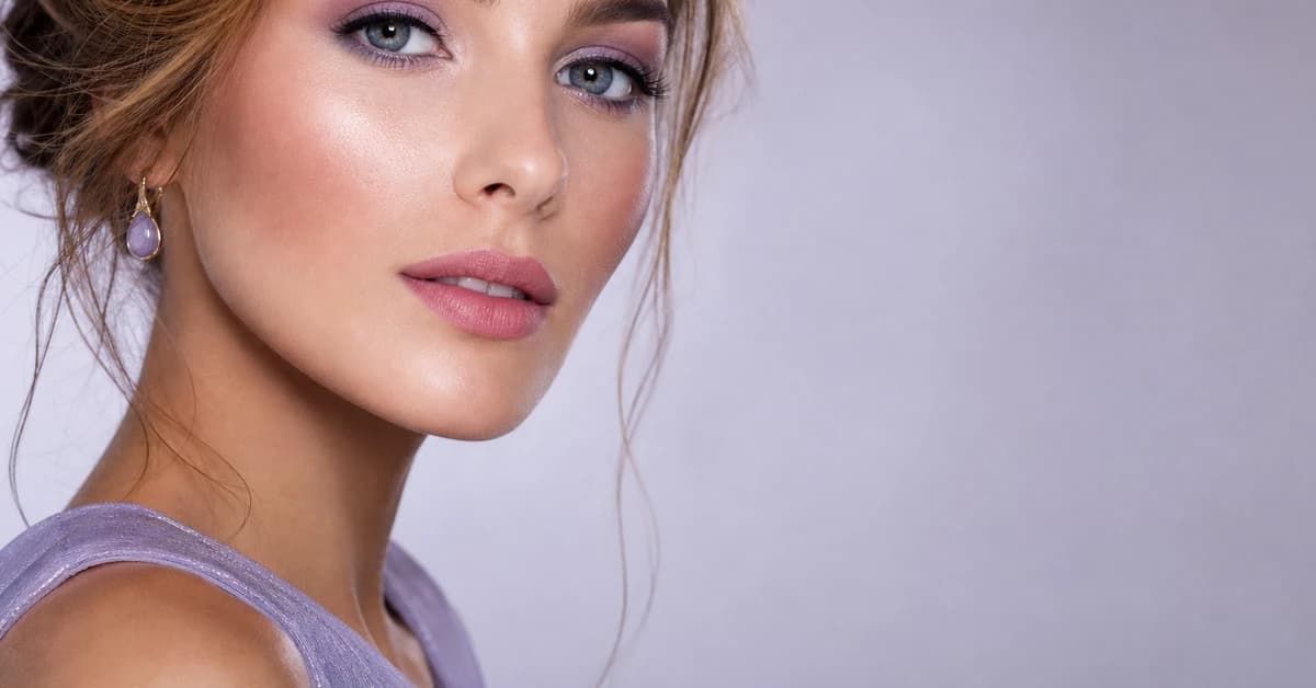 A woman wearing True Summer makeup — a cool rose lip, soft-pink blush and slate-grey eyes, by ToneLala