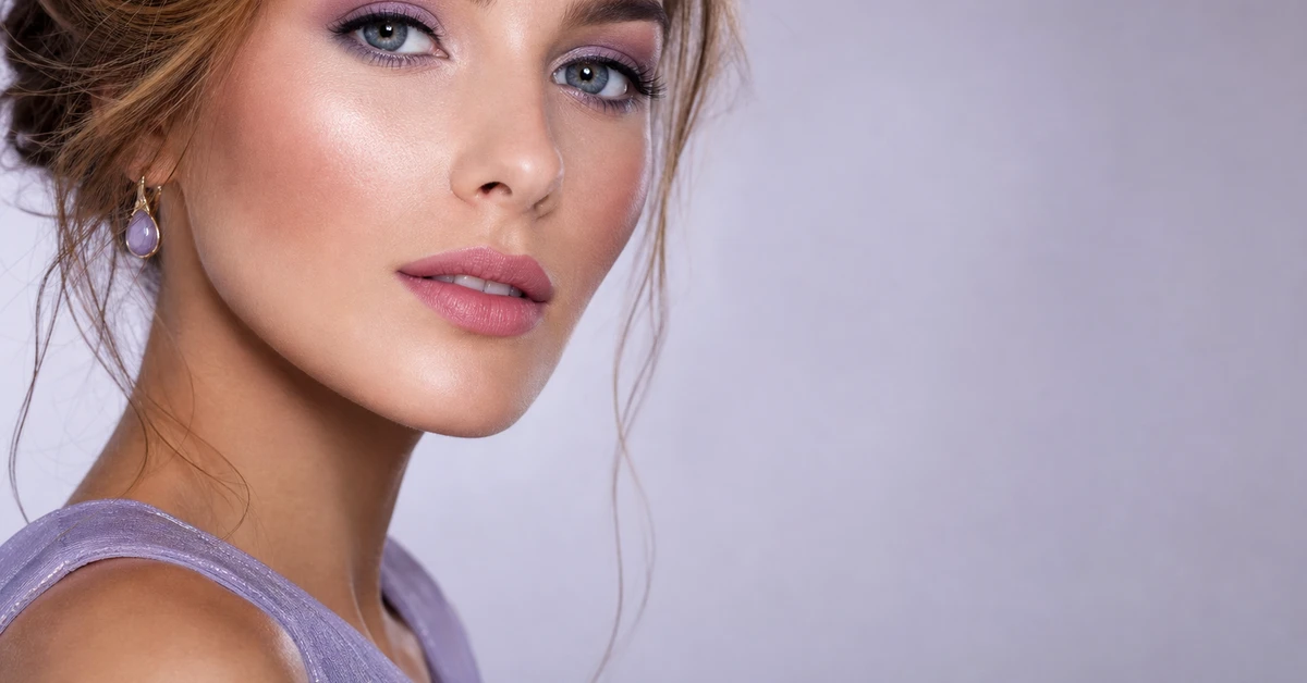 A woman wearing True Summer makeup — a cool rose lip, soft-pink blush and slate-grey eyes, by ToneLala